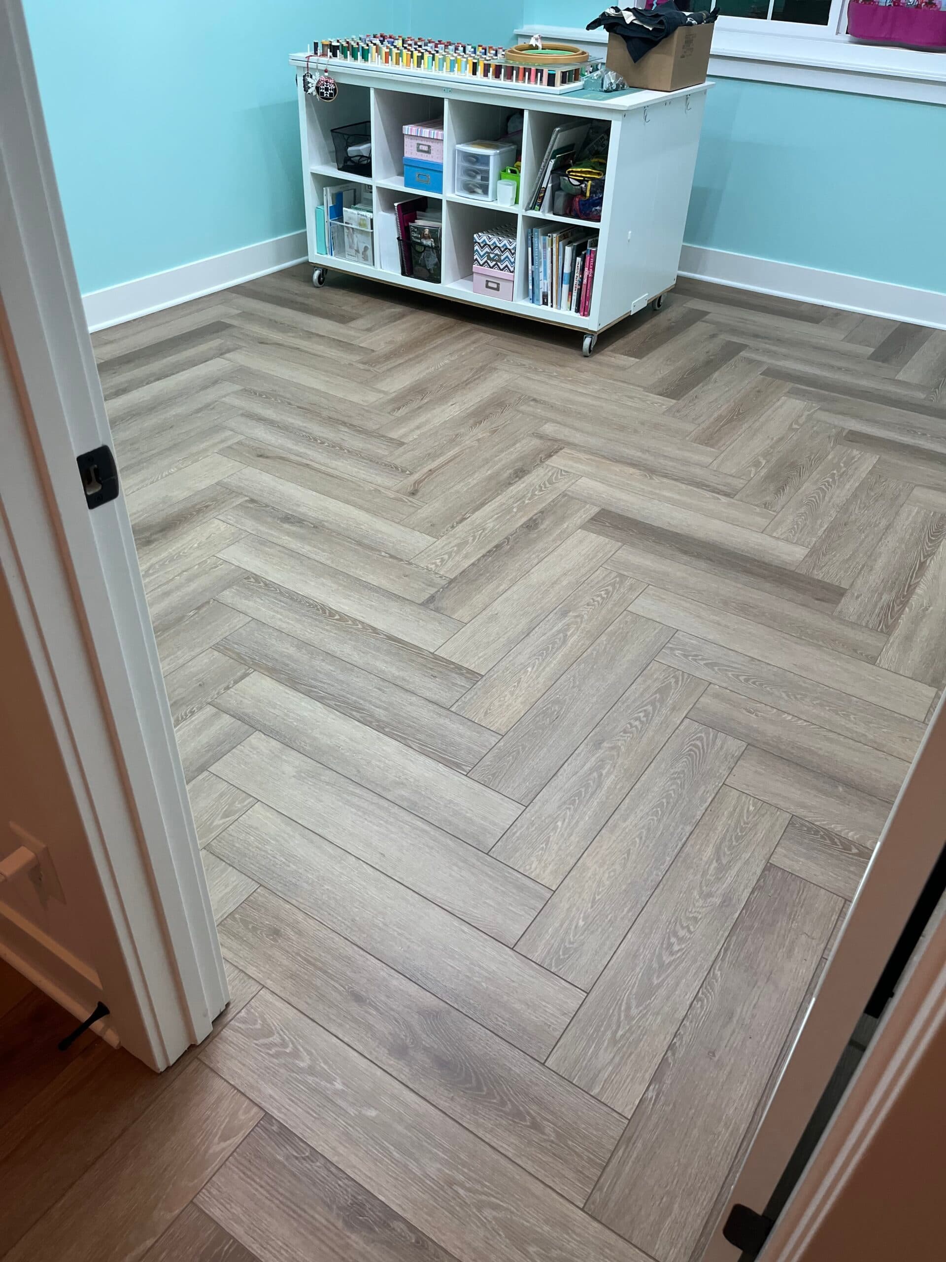 Product: Paramount Rigid Core Herringbone. Color: Bridgewater Brown