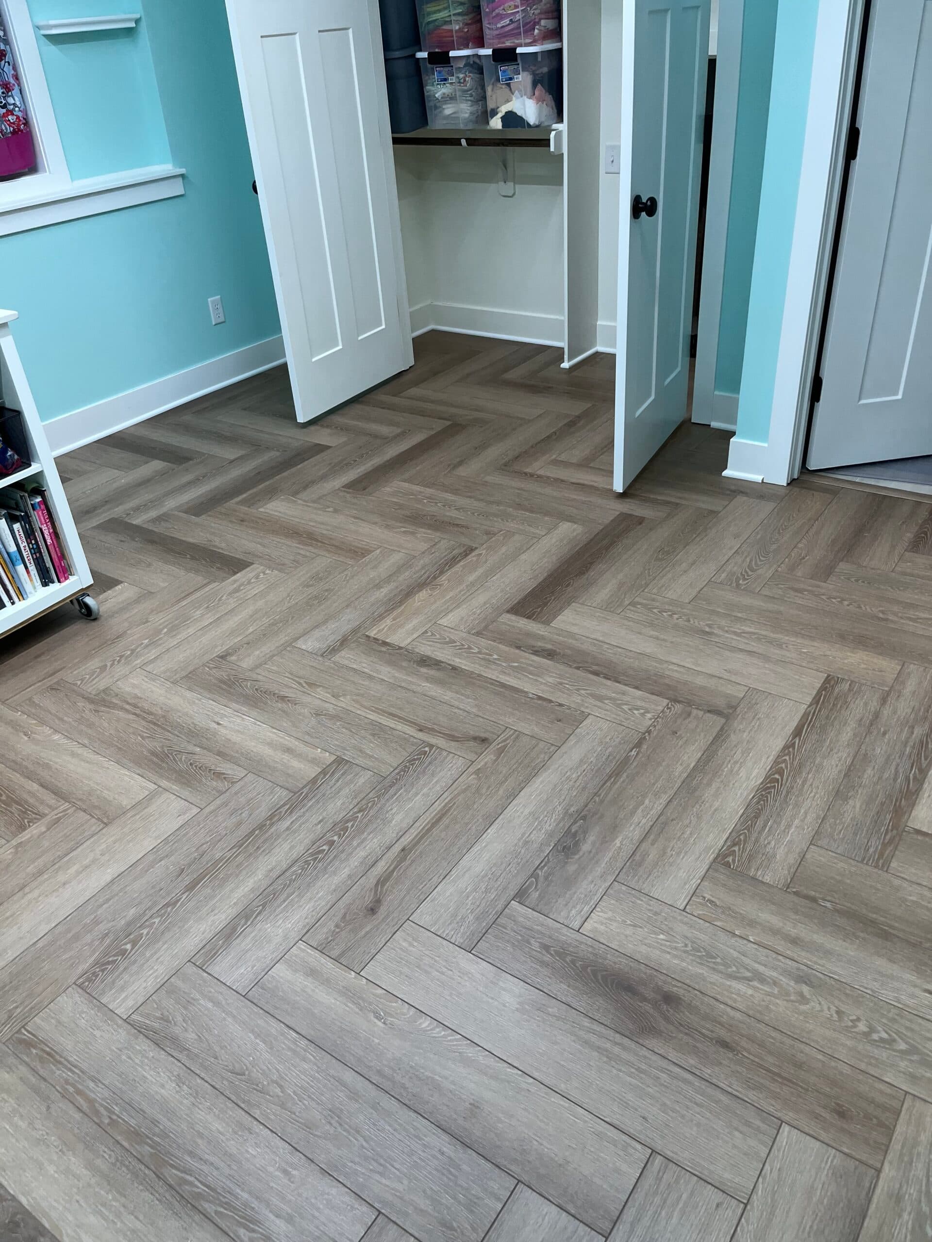 Product: Paramount Rigid Core Herringbone. Color: Bridgewater Brown